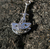Functional Climbing Cam anchor Pendant - Handmade in sterling - silver - Edge view - Rock background