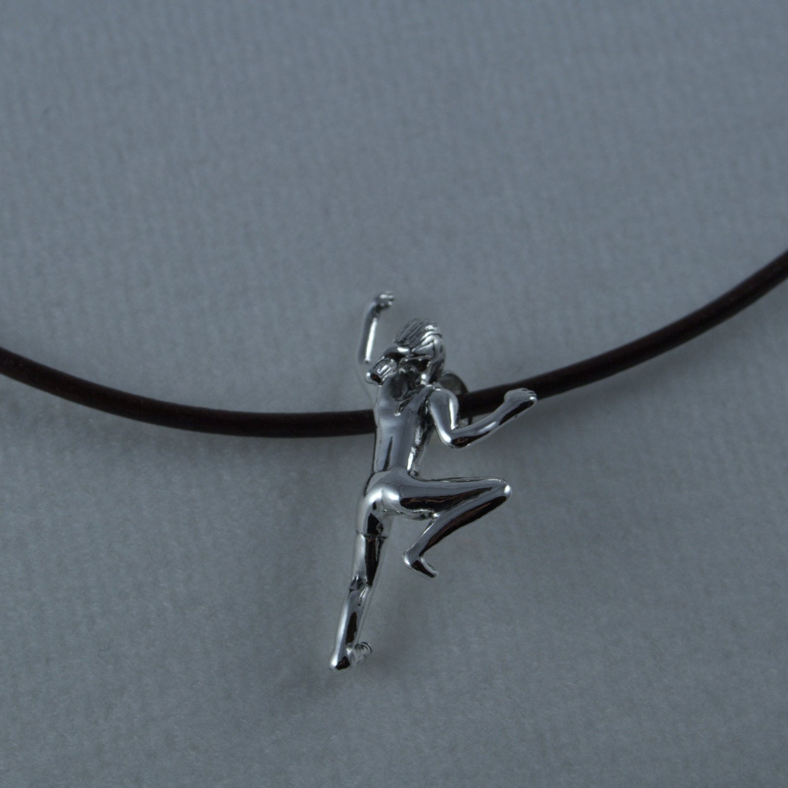 Climbing Girl Figurine Necklace - Handmade in sterling silver -Shown on brown leather c ord