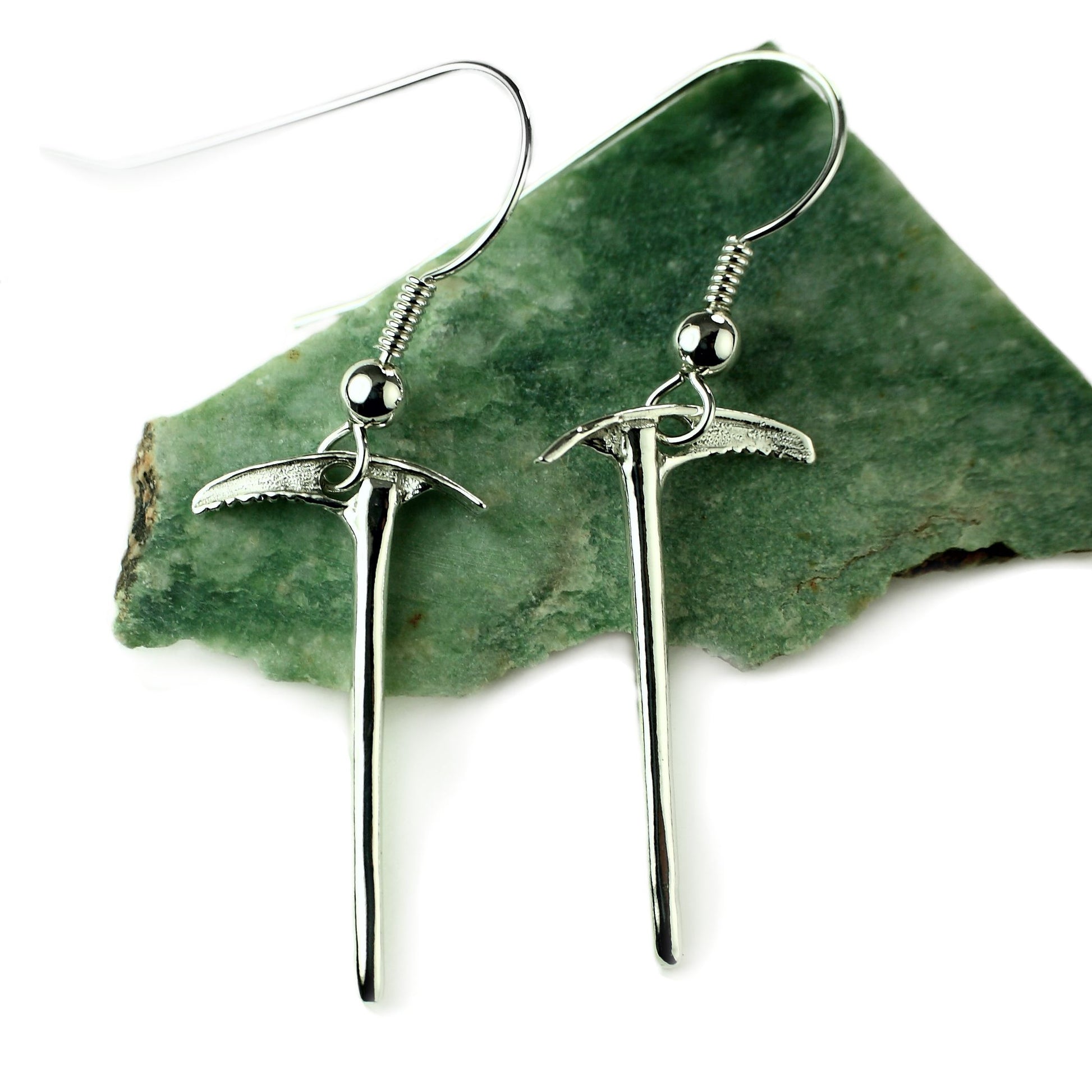 sterling silver miniature ice axe dangle earring pair, rock background