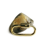29 mm 18 karat solid gold quick link miniature lock carabiner - rock background