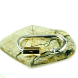29-mm Sterling-Quick-Link-Carabiner-Lock- With-14k-Yellow-Gold-Nut-Open-Rock-Background