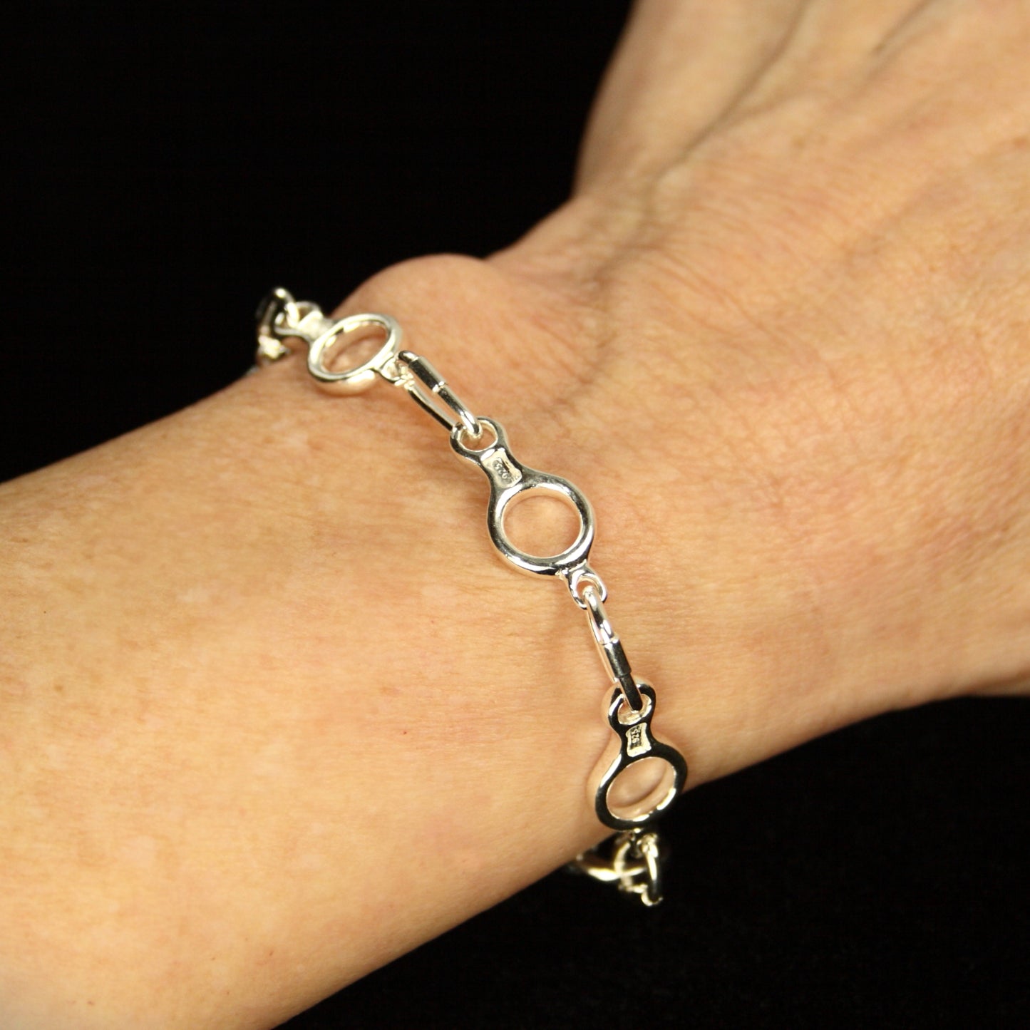 Figure 8 Descender Linked Bracelet - Handmade in sterling silver - Modeled on wrist