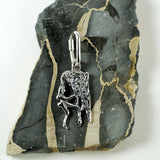 Ascending a rock face pendant handmade in sterling silver - rock background