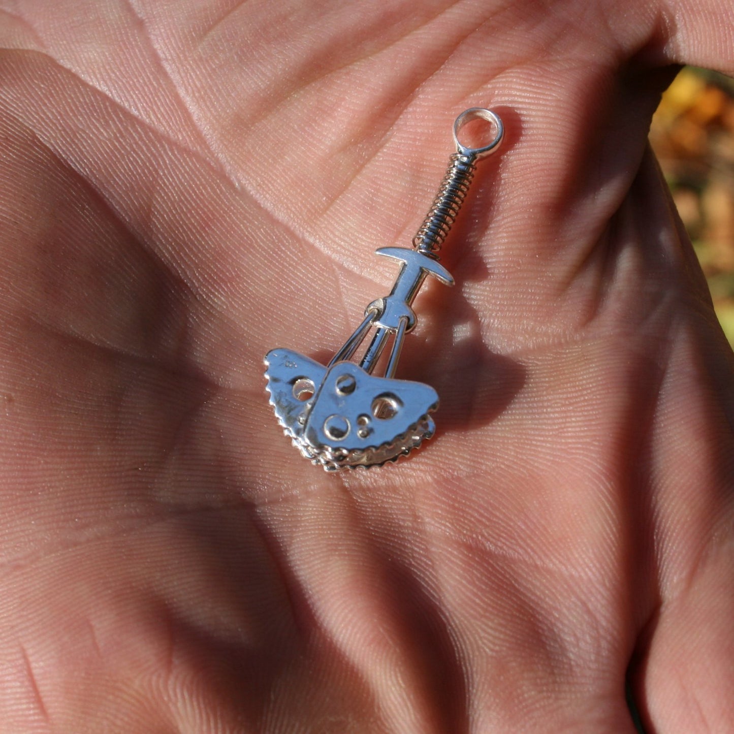 Functional Climbing Cam anchor Pendant - Handmade in sterling silver - Modeled held in hand