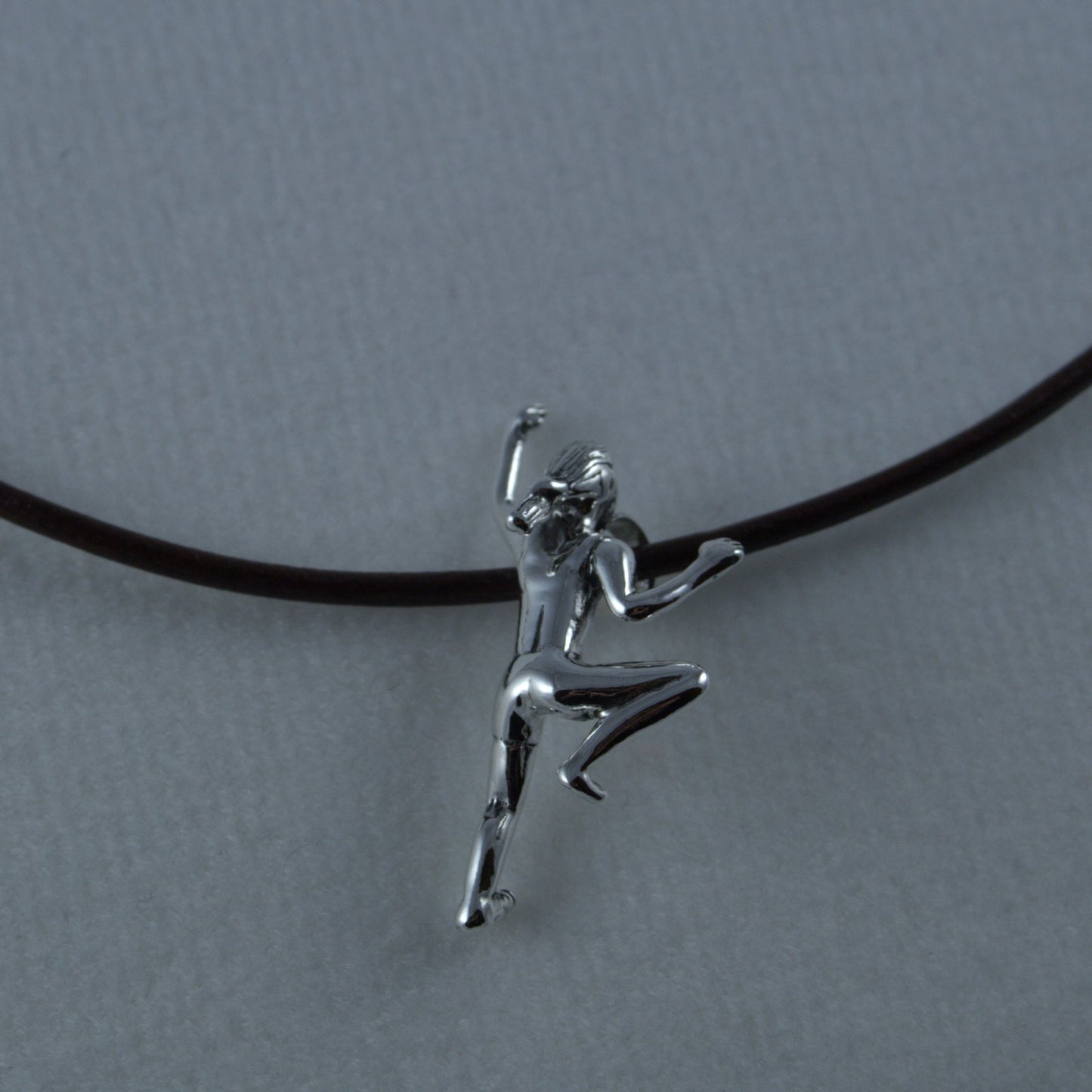 Climbing Girl Figurine Necklace - Handmade in sterling silver -Shown on brown leather c ord