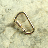 functional miniature carabiner lock solid 14k yellow gold rock background