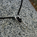 Pirana Descender Necklace - Handmade in sterling silver - Rock background